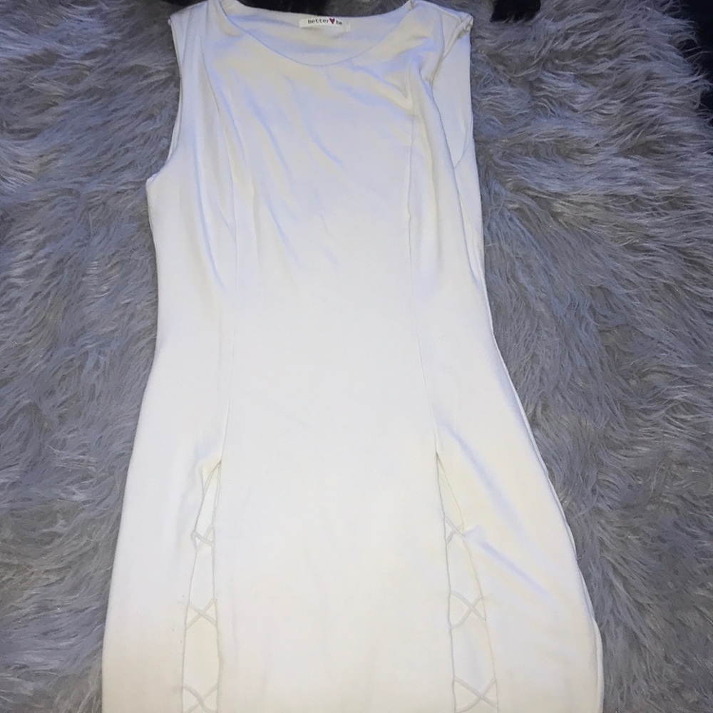 White dress with criss cross opening at legs